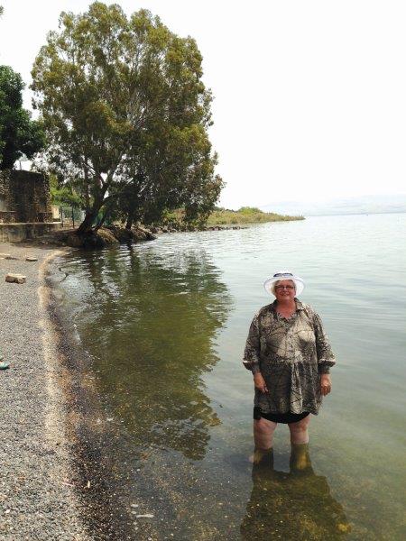 Jeni Goring wading in the sea of Galilee. 