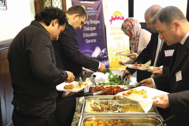 Guests at a Community Iftar Dinner break their fast during Ramadan in 2014. 