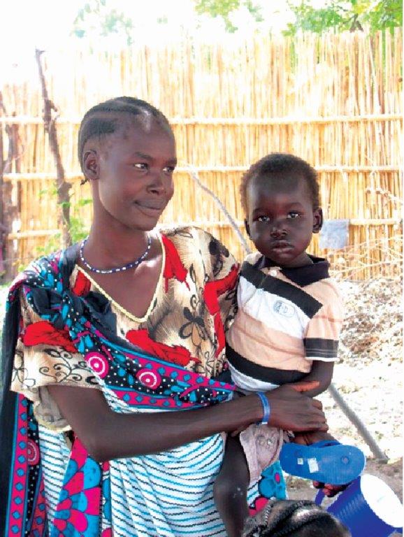 Gifts from Everything in Common help support midwives like Deborah, pictured here. 
