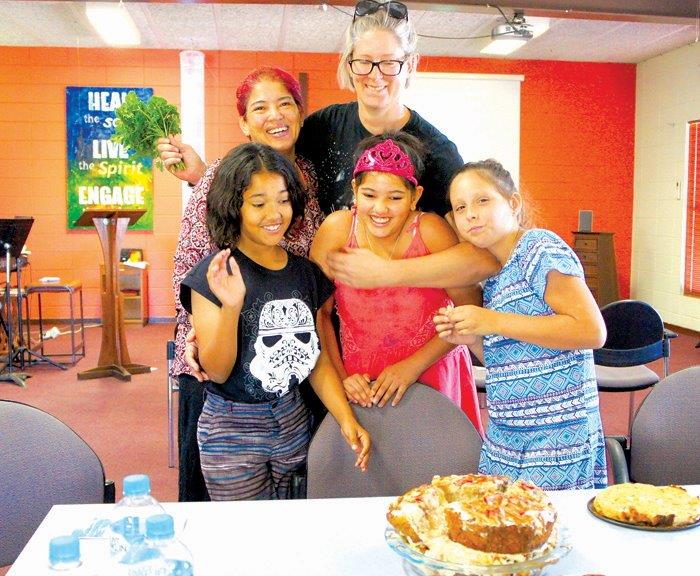 Crystal Claite and Natasha Bargeus (back) with Caitlin, Darian and Mia celebrating a birthday at Port Hedland Uniting Church. 